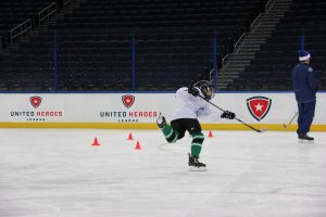 Child in UHL hockey clinic taking a Slapshot